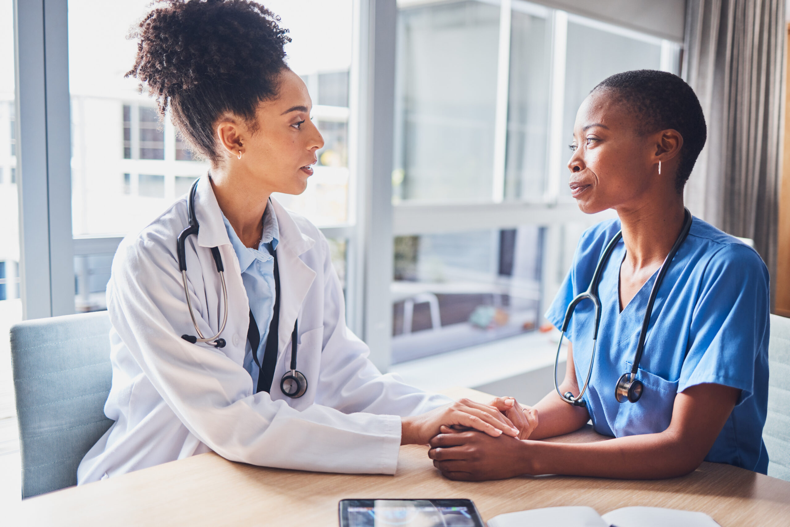 Doctors, mental health and mentor support intern, depression and in hospital with stress. Female employees, women and medical professionals with burnout, overworked and depressed in clinic and sad.